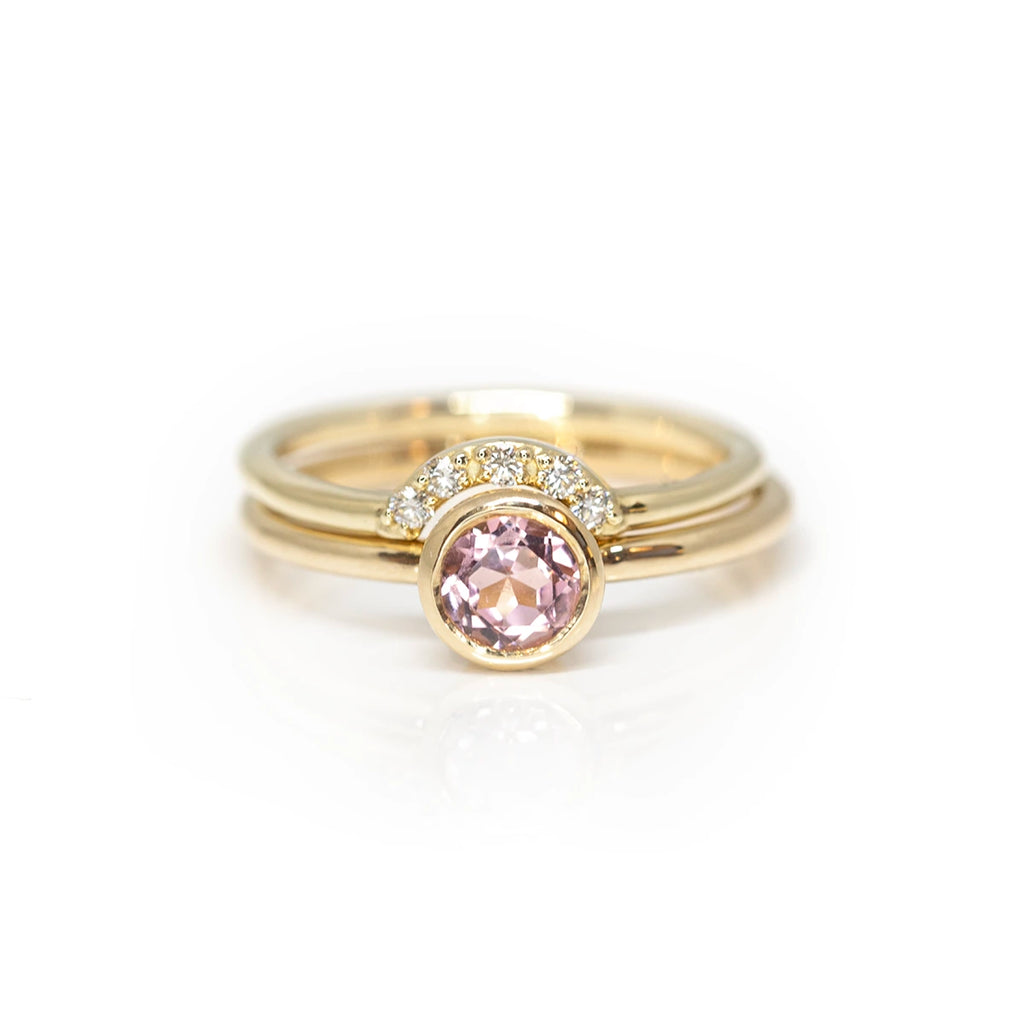 pink tourmaline bezel setting yellow gold artisan handmade engagement with it's matching band by sheena montreal fine jewelry designewr for the jeweler ruby mardi on a white background