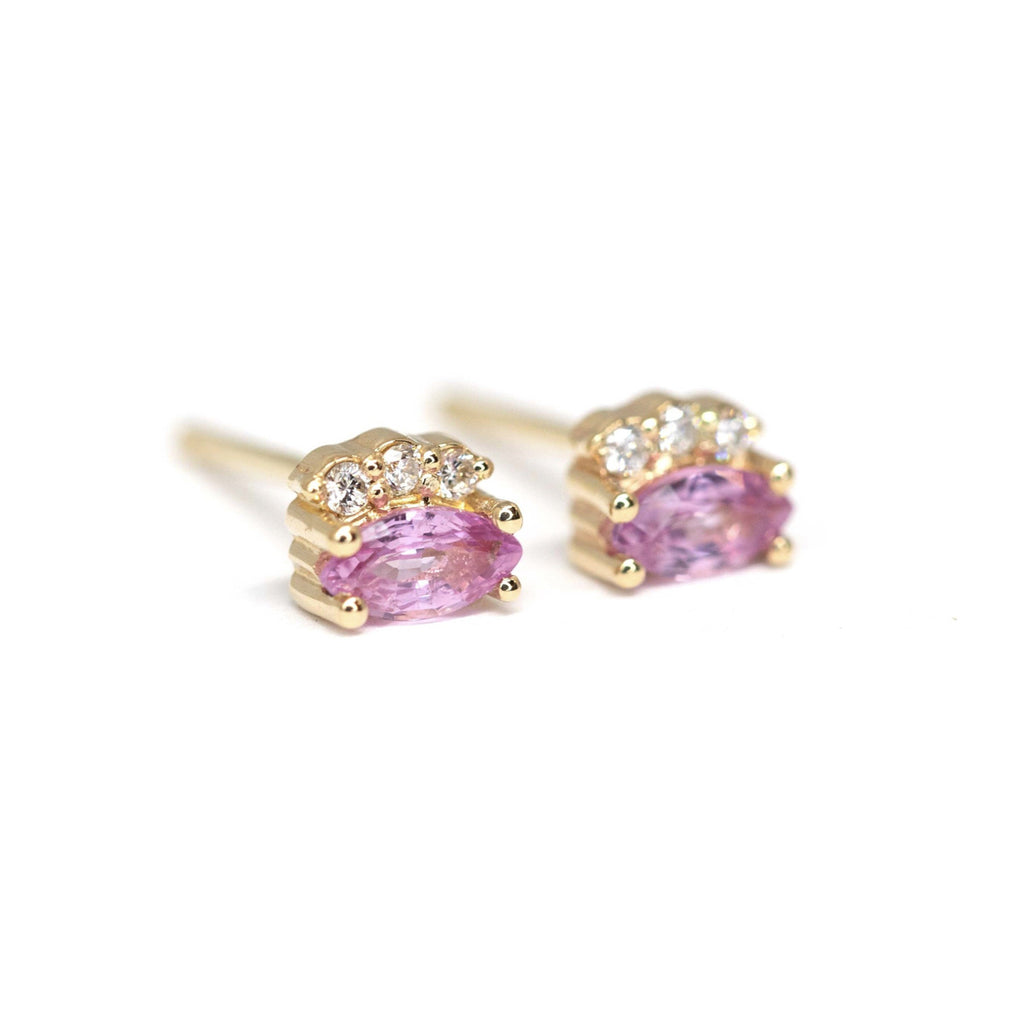 Pink Sapphire Earrings with 3 small diamonds on a white background. Sapphire gemstone stud gold earrings created by Ruby Mardi, a fine jewelry store in Montreal's Little Italy, close by Outremont, Rosemont, Villeray and Mile End districts. 
