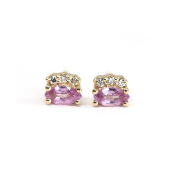 Pink Sapphire Earrings with 3 small diamonds on a white background. Sapphire gemstone stud gold earrings created by Ruby Mardi, a fine jewelry store in Montreal's Little Italy. We can source ethical gemstones, natural diamonds, lab grown diamonds, Canadian Diamonds. 