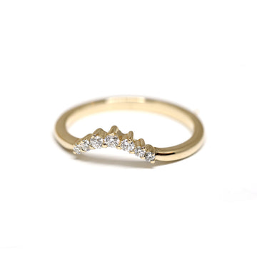 Beautiful delicate dainty yellow gold diamond band by Yuliya Chorna and available at Ruby Mardi, a high end jewelry store showing the most talented Canadian jewellery designer. 
