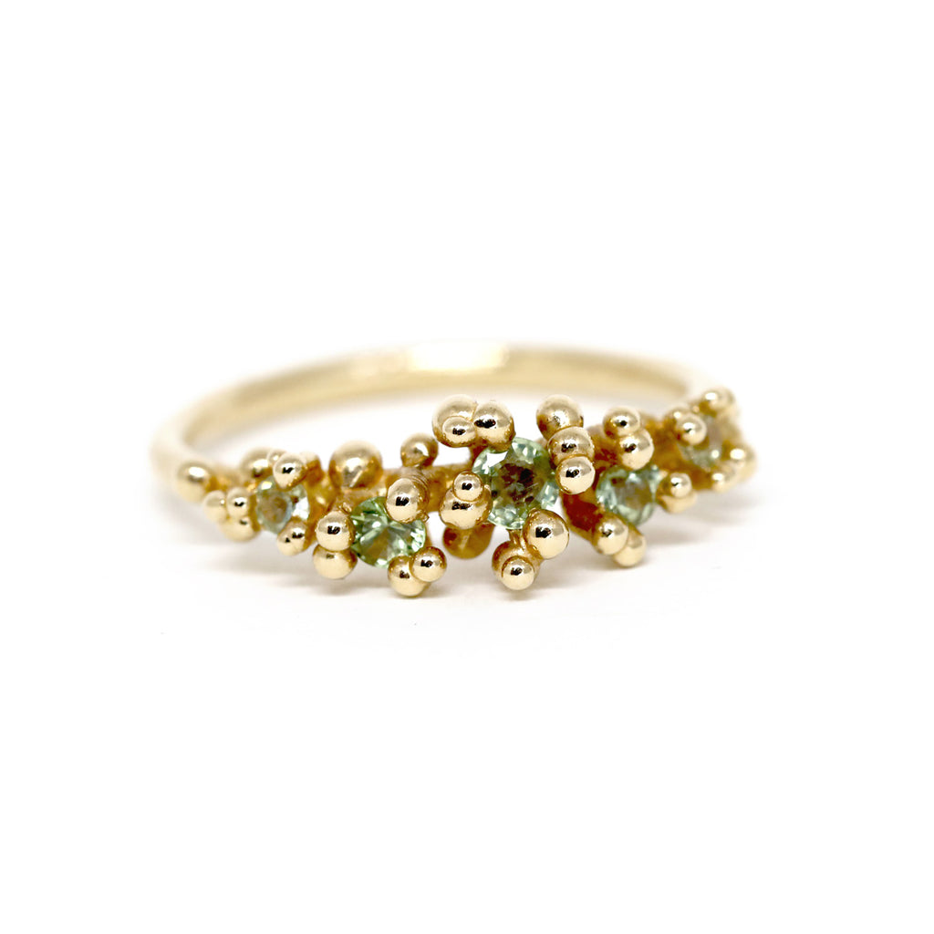 yellow gold green sapphire gold ring made the artisan jewellery desginer meg lizabet canadian jewelry design on a white background