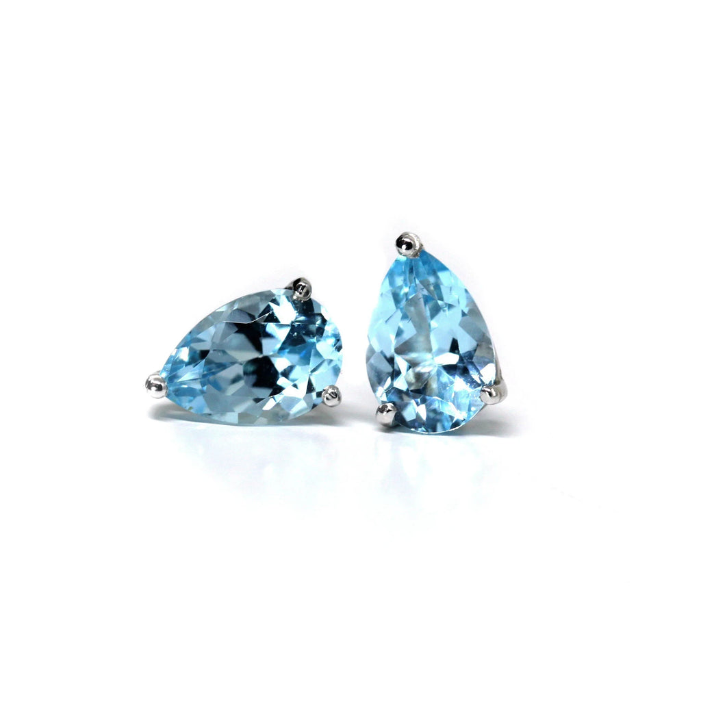 pear shape blue topaz silver stud earrings custom made in montreal at the best jewelry store boutique ruby mardi fine jewellery designer gallery in quebec on a white background