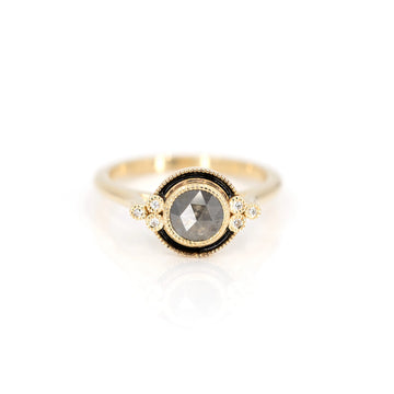 Ring made by jewelry designer Emily Gill with black enamel and surrounded by small white diamonds. This unique ring with a vintage art-deco style is available at Boutique Ruby Mardi in Montreal.