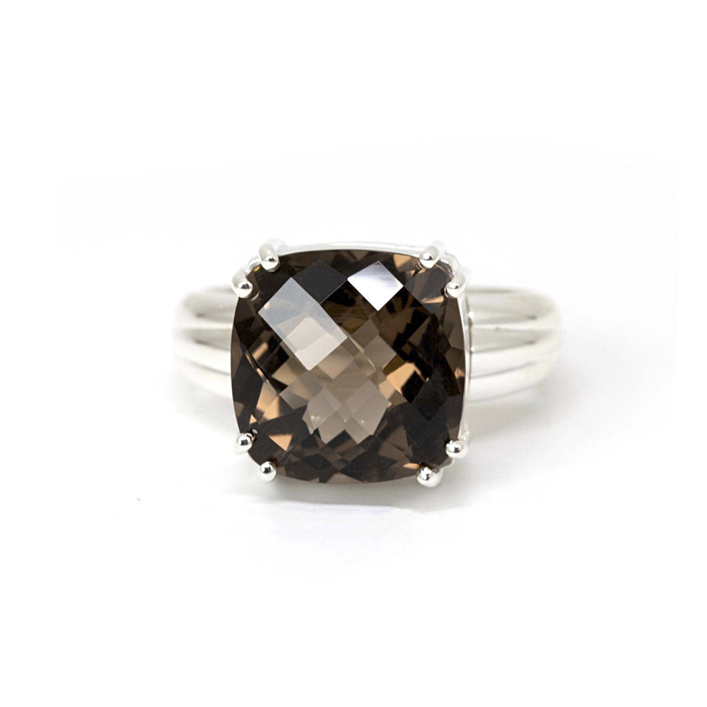 Dark smoky quartz gemstone set in sterling silver by designer Bena Jewelry, a one-of-a-kind gender neutral statement ring. Find the most exquisite designer jewelry at Ruby Mardi, a fine jewelry store in Montreal that presents the work of the most talented Canadian jewelry designers. Custom jewelry services also offered.
