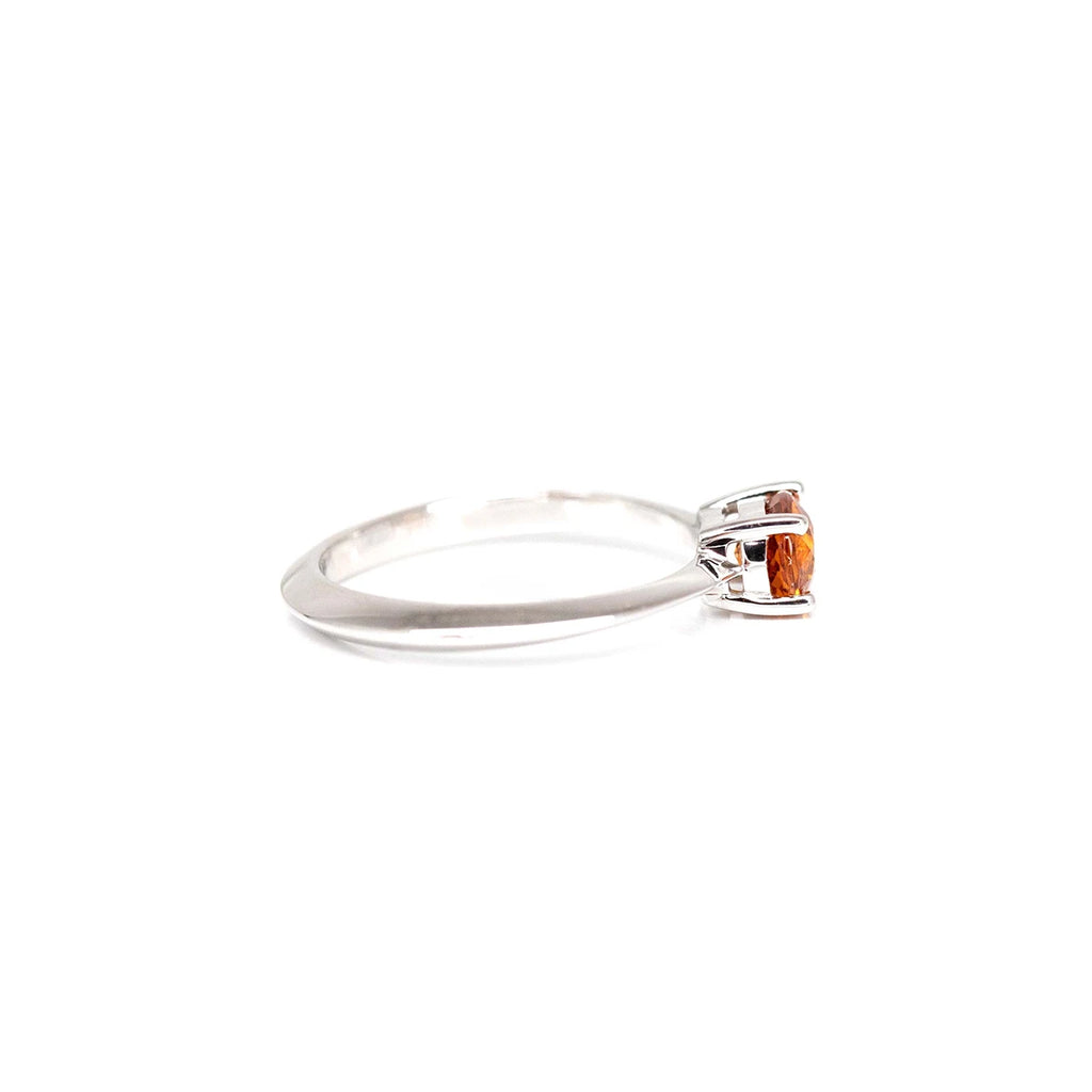 side view of white gold custom made ring montreal designer jewelery oval shape orange garnet ring bena ruby mardi canadian best designer