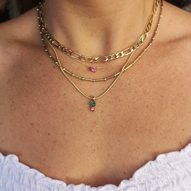 girl wearing colored gemstone tourmaline green and red on yellow gold lico jewelry avialable at ruby mardi best jeweler in montreal