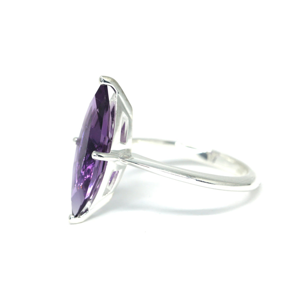 Product photography of a beautiful ring in sterling silver featuring a huge marquise amethyst, by designer Bena Jewelry. Find the most exquisite designer jewelry at Ruby Mardi, a fine jewelry store in Montreal that presents the work of the most talented Canadian jewelry designers. Custom jewelry services also offered.