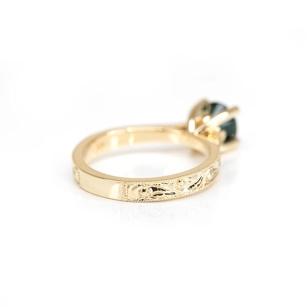 Back view of a yellow gold designer engagement ring custom made with a green sapphire from Australia, available at Ruby Mardi, an upscale Canadian jewelry store specializing in designer one-of-a-kind jewels and bridal jewelry.