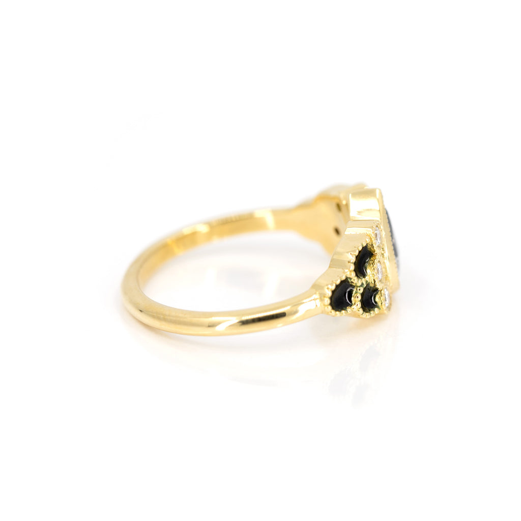 side view of yellow gold enamel custom made engagement ring by emily gill best canadian jewelry designer at boutique ruby mardi jeweler in montreal on white background
