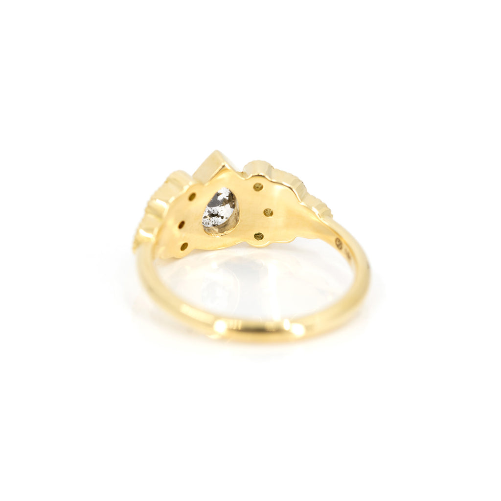 back view of emilly gill custom made yellow gold engagement ring in montreal at boutique ruby mardi best jewelry store in montreal on white background