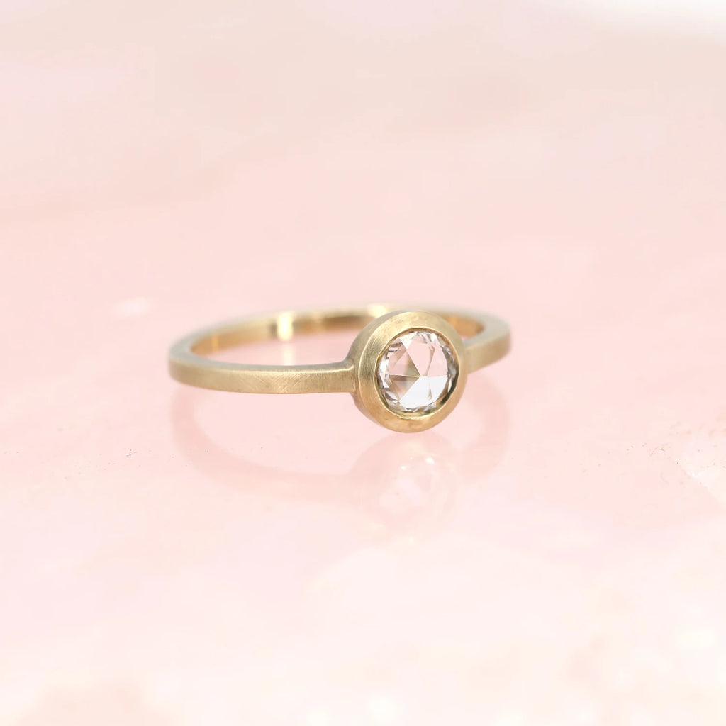 Rose cut white sapphire bezel set yellow gold alternative bridal ring, handcrafted in Toronto by Arsaeus Designs and available at the best jewellery store in Canada, RUBY MARDI, which sells designer jewels and the best engagement rings in Montreal. 