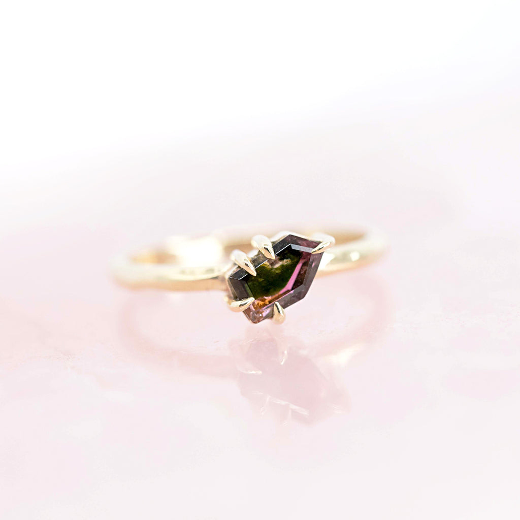 Original one of a kind yellow gold solitaire ring with a watermelon tourmaline showing mostly dark hues but also pink and green hues. Would make a beautiful engagement ring. Dainty and elegant.