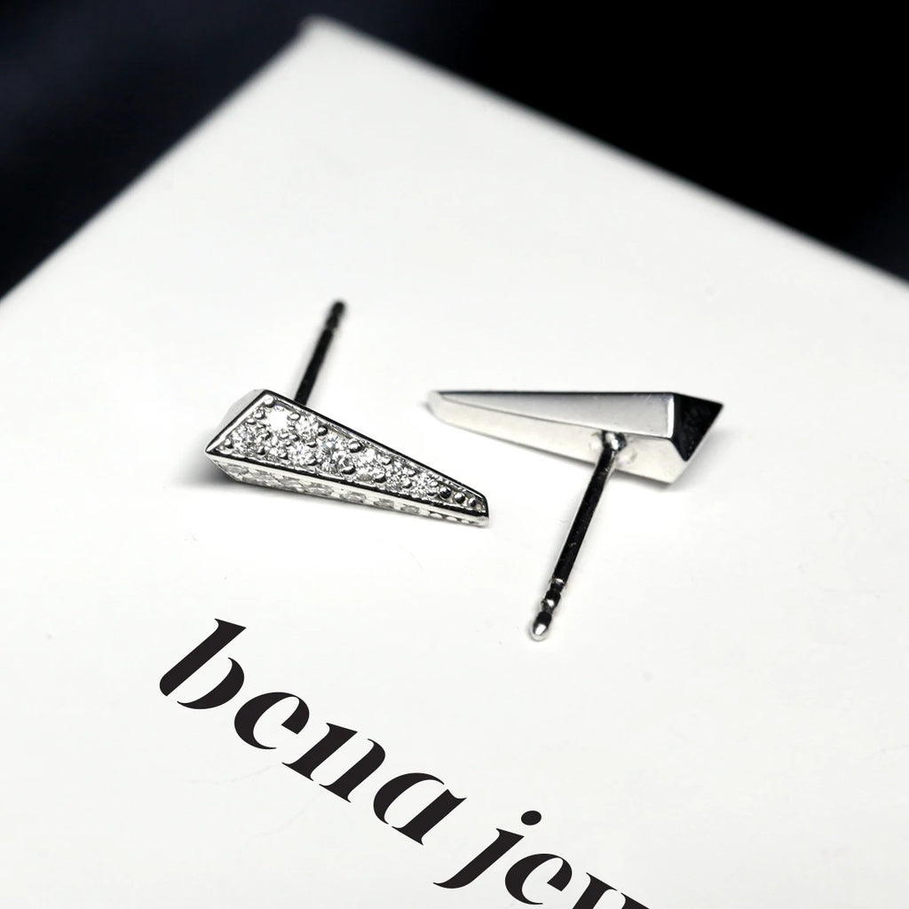 top view of bena jewelry lab grown diamond stud earrongd custom made fine jewellery in montreal at the best jeweler boutique ruby mardi on black and white background