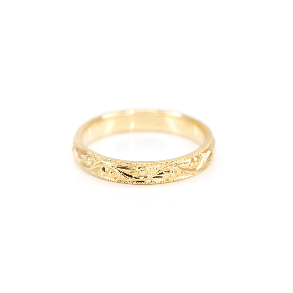 top view of yellow gold custom made ring and wedding band by the fine jewelley designer Deborah Lavery in montreal for the finest jeweler in montreal boutique ruby mardi on a white background