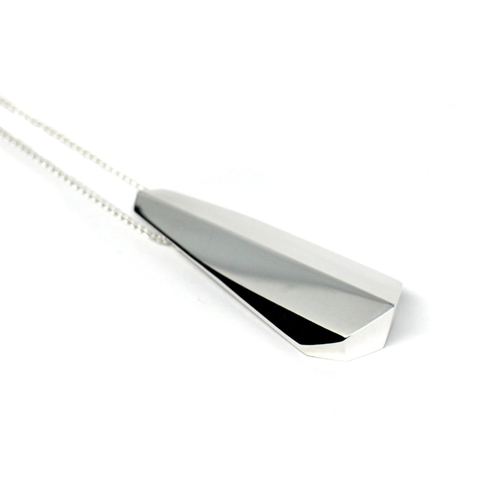 side view of silver ballast edgy bena jewelry pendant unisex jewellery design custom made in montreal at boutique ruby mardi best jewellery store in canada on white background
