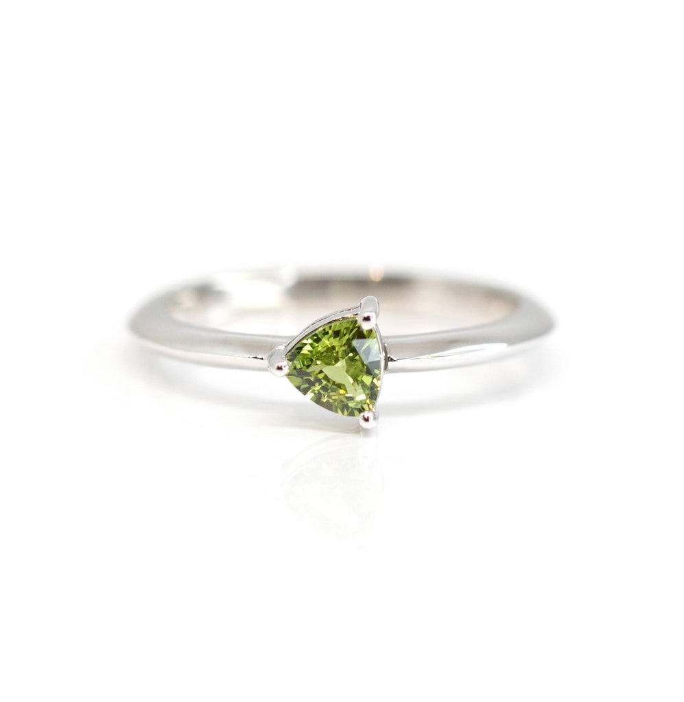 custom made green sapphire ring in montreal green colored gemstone natural and white gold available at the best jewelry store in montreal boutique ruby mardi on a white background
