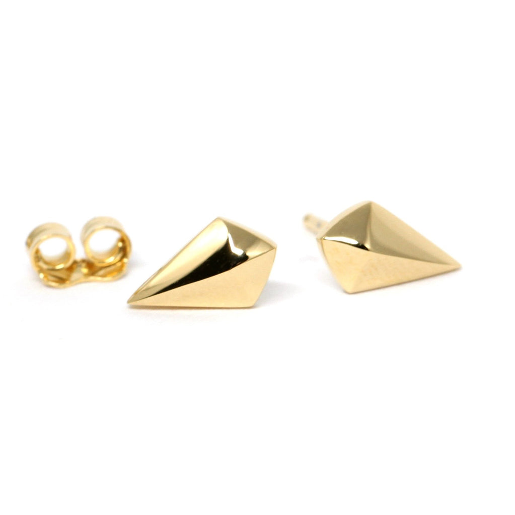 Stud earrings in 10k yellow and white gold with sharp pyramid design, photographed on a clean white background.