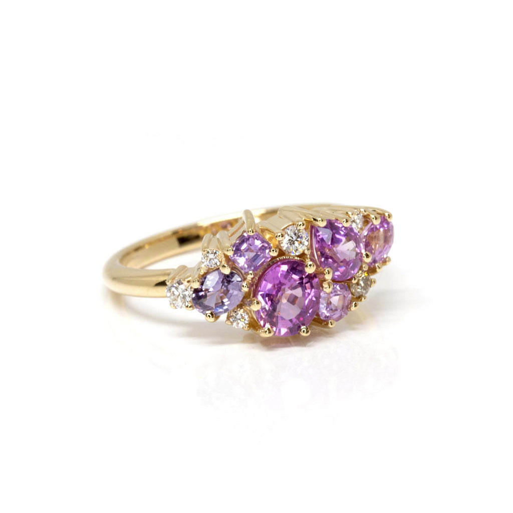 Stunning bridal jewelry by Ruby Mardi Montreal. A 14k yellow gold engagement ring or statement ring featuring natural pink, mauve, violet sapphires and round brilliant diamonds. 