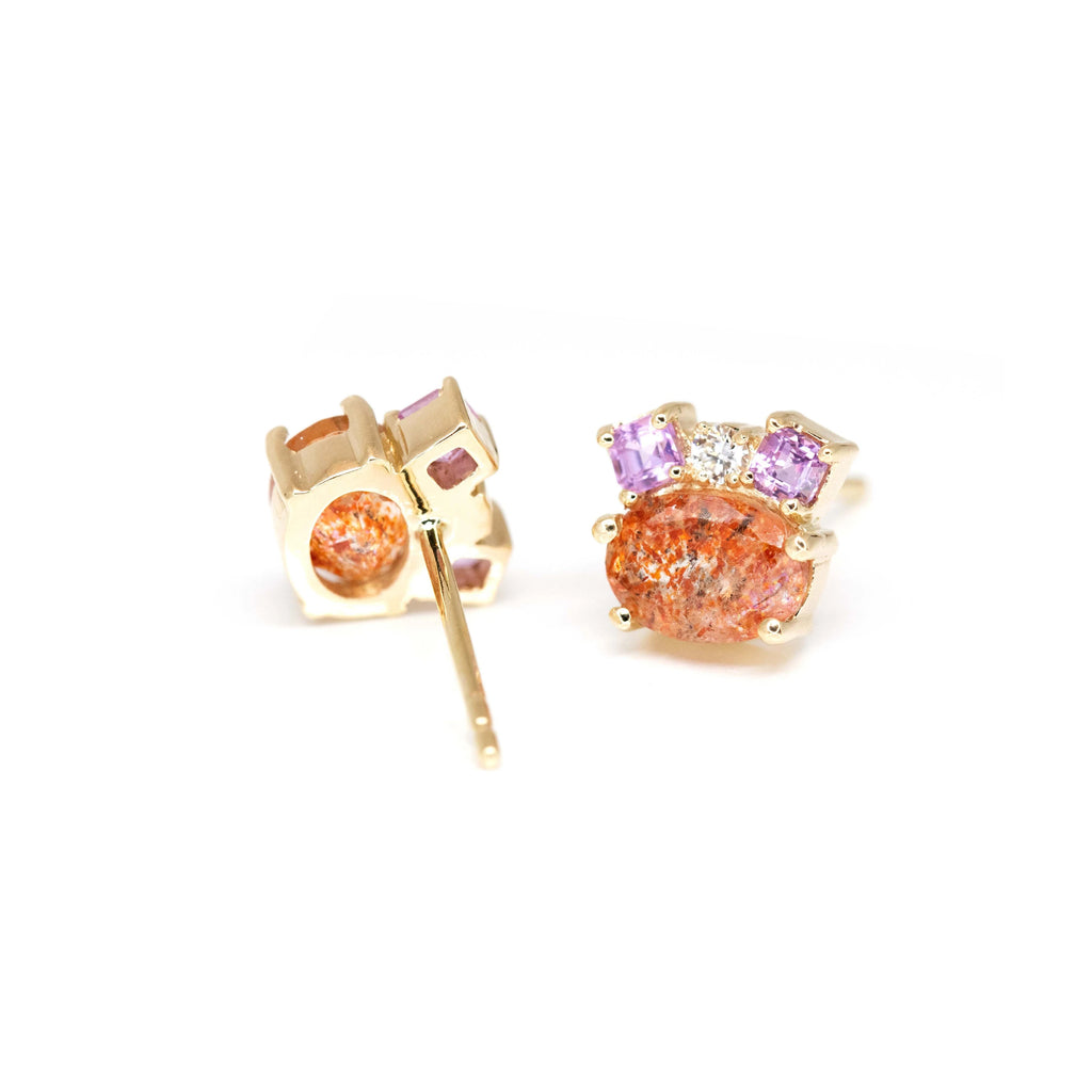 back view of yellow gold stud earrings with oval shape sunstone and pink sapphire diamond earrings stud custom made in montreal at the best jewelry store ruby mardi by bena jewelry designer on a white background